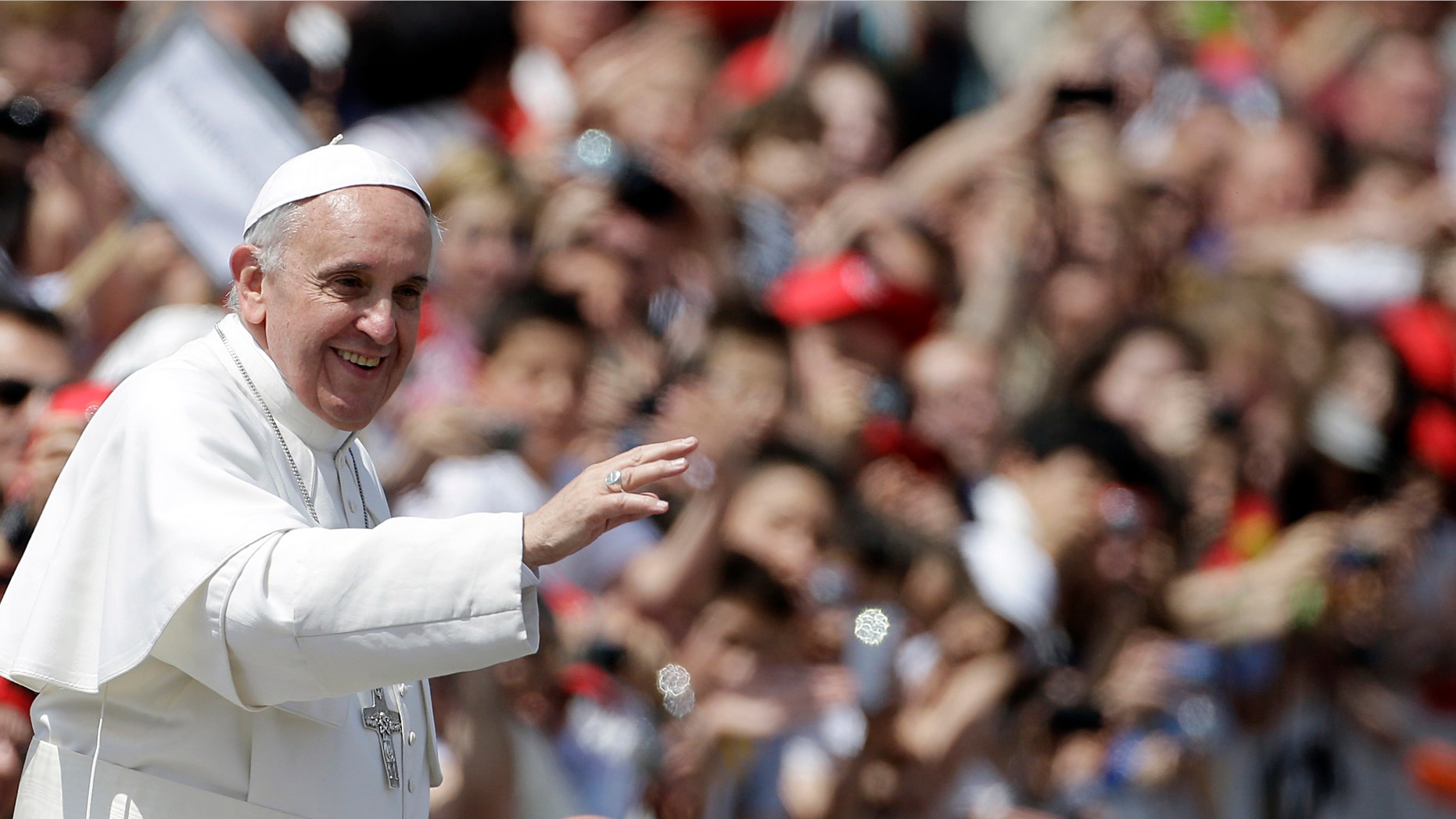 Pope Francis greets the faithful at the end of canonization mass in St. Peter's Square at the Vatican, Sunday, May 12, 2013. The Pontiff canonized, Antonio Primaldo and his companions, also known as the Martyrs of Otranto, Laura di Santa Caterina da Siena Montoya of Colombia, and Maria Guadalupe Garcia Zavala of Mexico. (AP Photo/Gregorio Borgia)