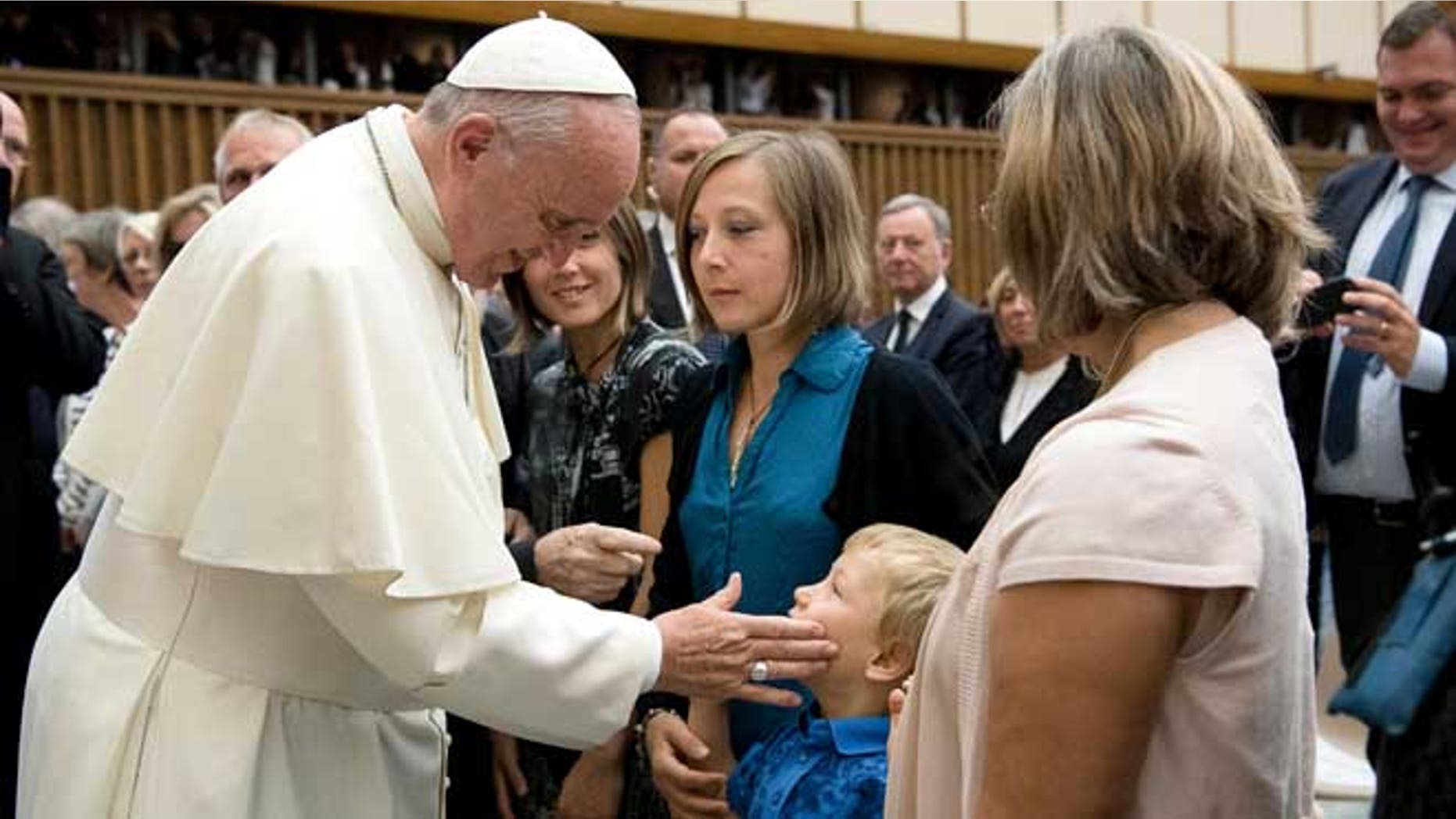Pope Francis meets relatives of the victims of the Nice truck attack this summer, during a special audience in the Pope Paul IV hall, at the Vatican, Saturday, Sept. 24, 2016. Pope Francis has received relatives of the victims of the Nice truck attack this summer, saying he offered ââ¬Åimmense compassionââ¬Â and encouraging them not to respond to hatred with hatred. (L'Osservatore Romano/Pool Photo via AP)