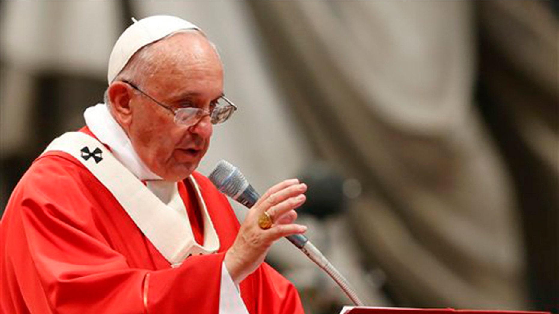 Pope Francis, left, celebrates a mass where he bestowed the Pallium, a woolen shawl symbolizing their bond to the pope, to 24 new Metropolitan Archbishops, in St. Peter's Basilica at the Vatican, Sunday, June 29, 2014. Looking tired but relaxed, Pope Francis has led his first major public ceremony after a spate of canceled appointments for health problems. (AP Photo/Riccardo De Luca)
