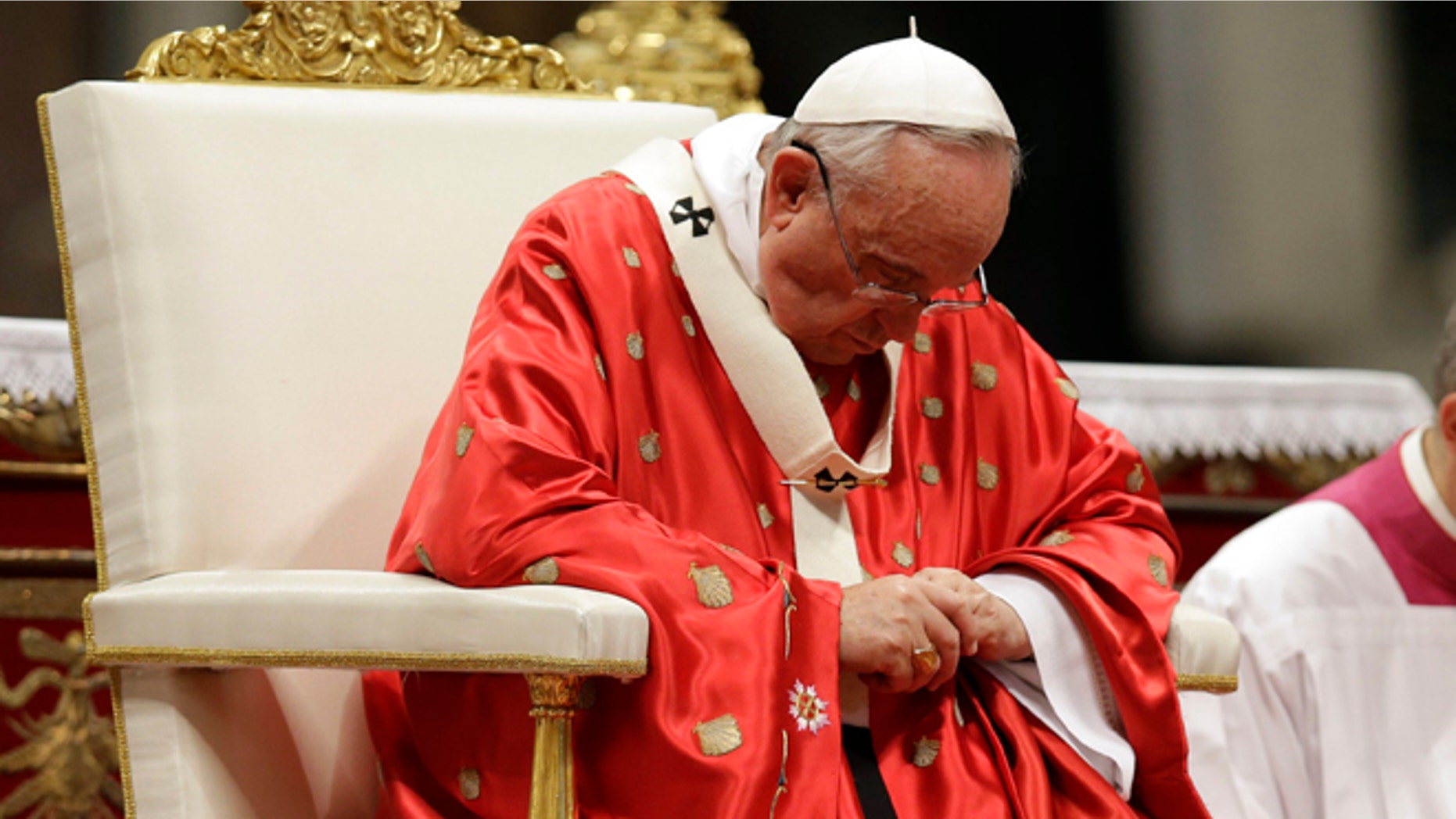 Pope Francis celebrates a mass of Pentecost in St. Peter's Basilica, at the Vatican, Sunday, May 24, 2015. Pope Francis urged pilgrims filling St. Peter's Square on Pentecost Sunday to take "the heroic examples" of a slain El Salvadoran bishop and an Italian nun who worked in Kenya who were beatified this weekend. (AP Photo/Gregorio Borgia)