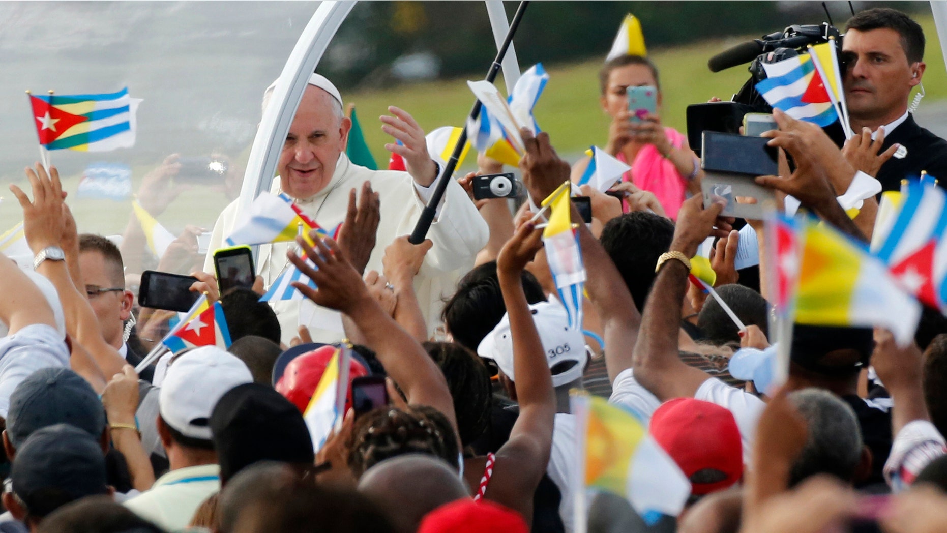 Pope Francis arrives for Mass at Revolution Plaza in Havana, Cuba, Sunday, Sept. 20, 2015. Pope Francis opens his first full day in Cuba on Sunday with what normally would be the culminating highlight of a papal visit: Mass before hundreds of thousands of people in Havana's Revolution Plaza. (AP Photo/Desmond Boylan)
