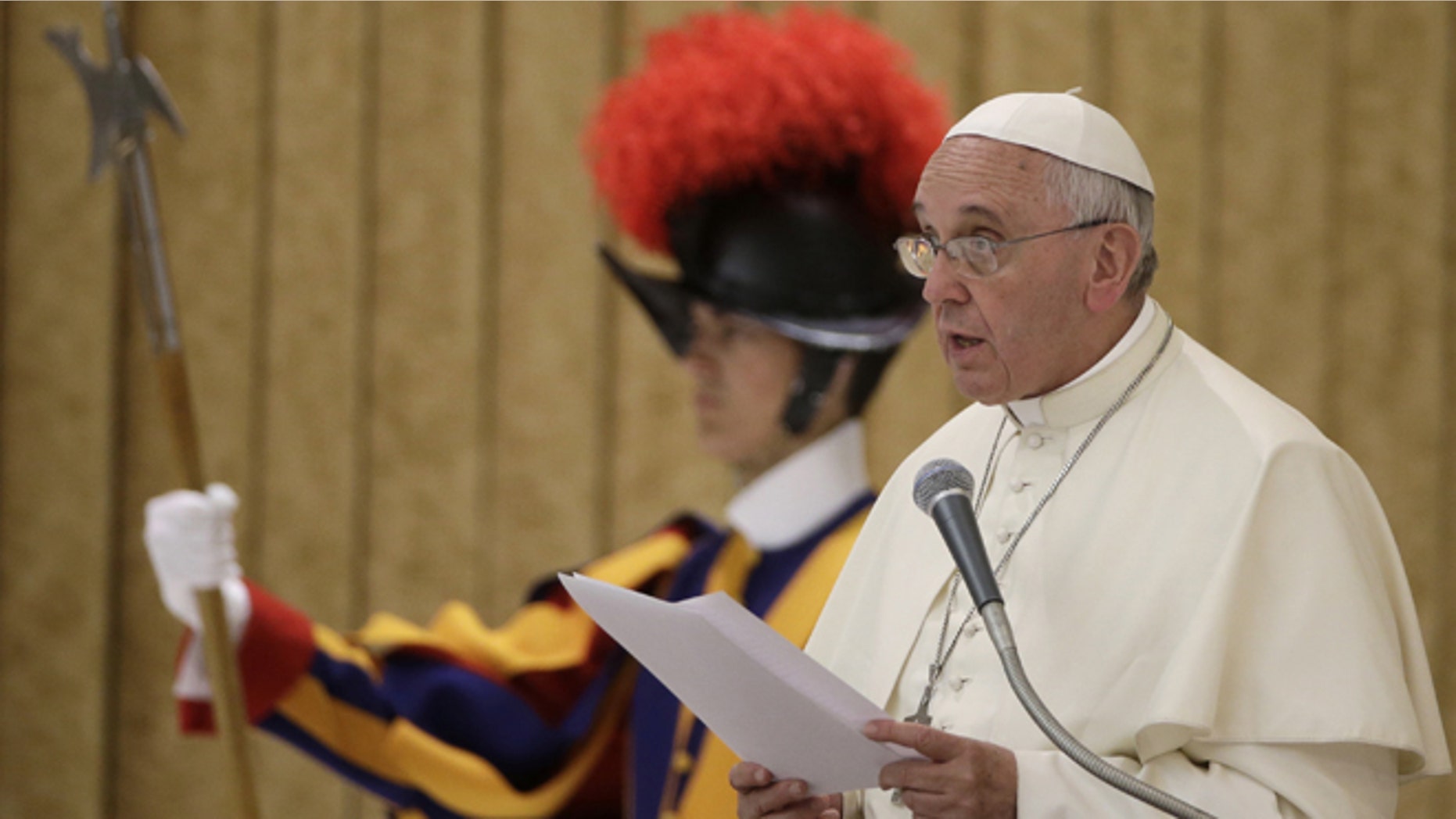 Pope Francis delivers his speech during an audience with relatives of police officers who died in the line of duty, in the Pope Paul VI hall, at the Vatican, Thursday, May 21, 2015. (AP Photo/Andrew Medichini)
