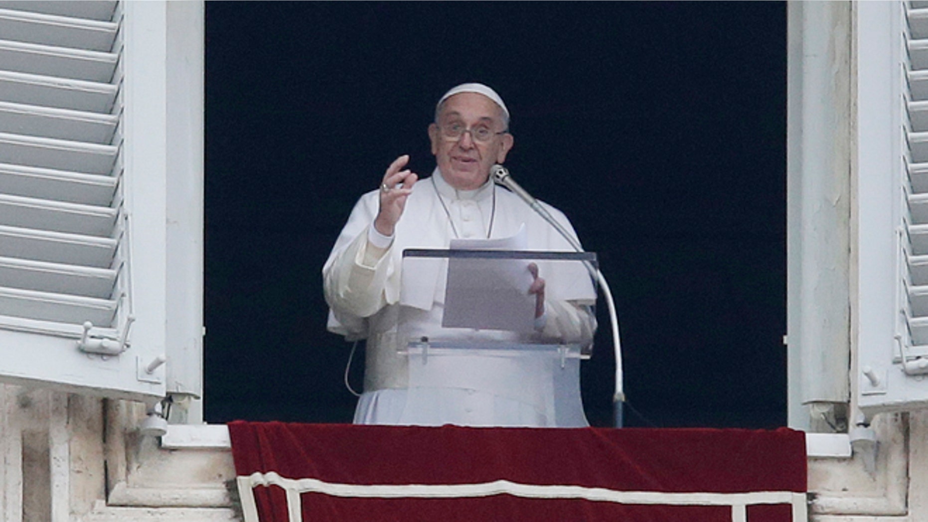 Pope Francis delivers his message during the Angelus noon prayer at the Vatican, Sunday, Jan. 11, 2015. Pope Francis on Sunday baptized 33 babies in the Sistine Chapel as part of an annual tradition, this year repeating an invitation to mothers to nurse their babies if crying out of hunger. For the first time in his pontificate, Francis celebrated Mass with his back to the faithful, according to the rites before the modernizing reforms of the Second Vatican Council in the 1960s. (AP Photo/Gregorio Borgia)