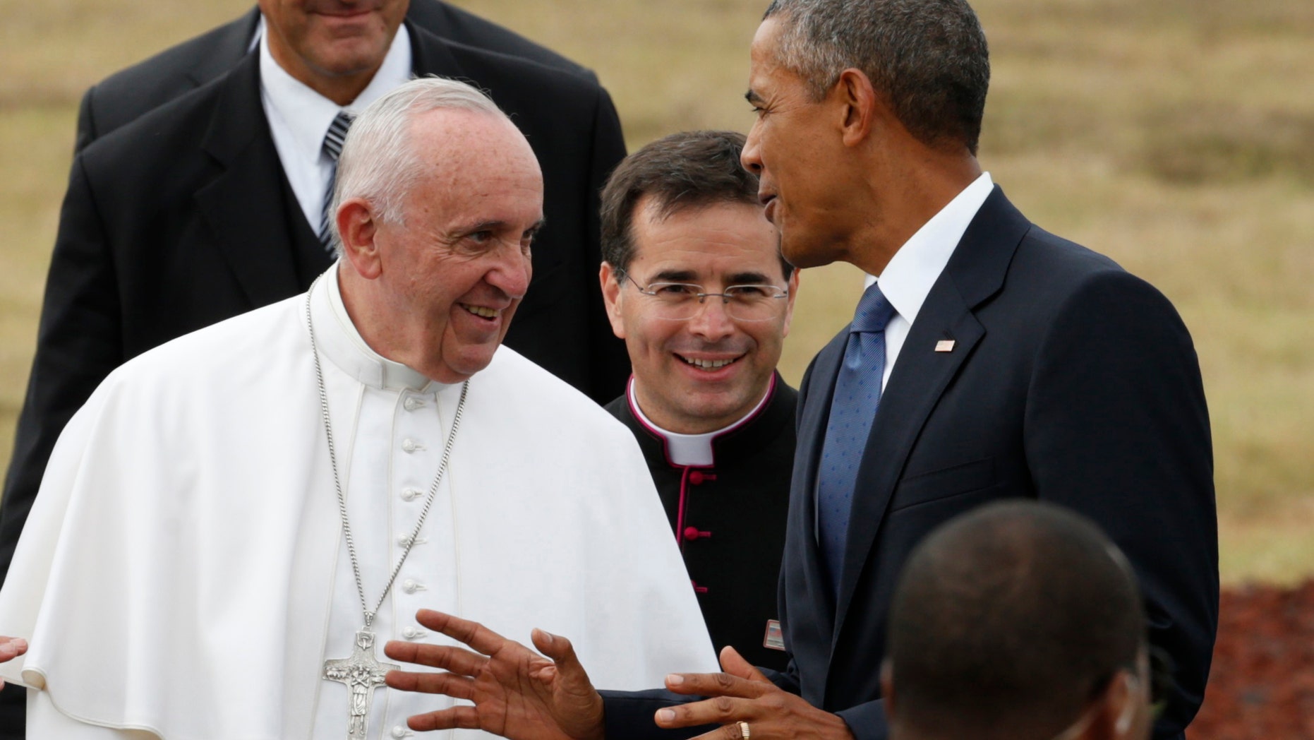 U.S. President Barack Obama chats with Pope Francis as he welcomes him upon his arrival at Joint Base Andrews outside Washington Sept. 22, 2015.
