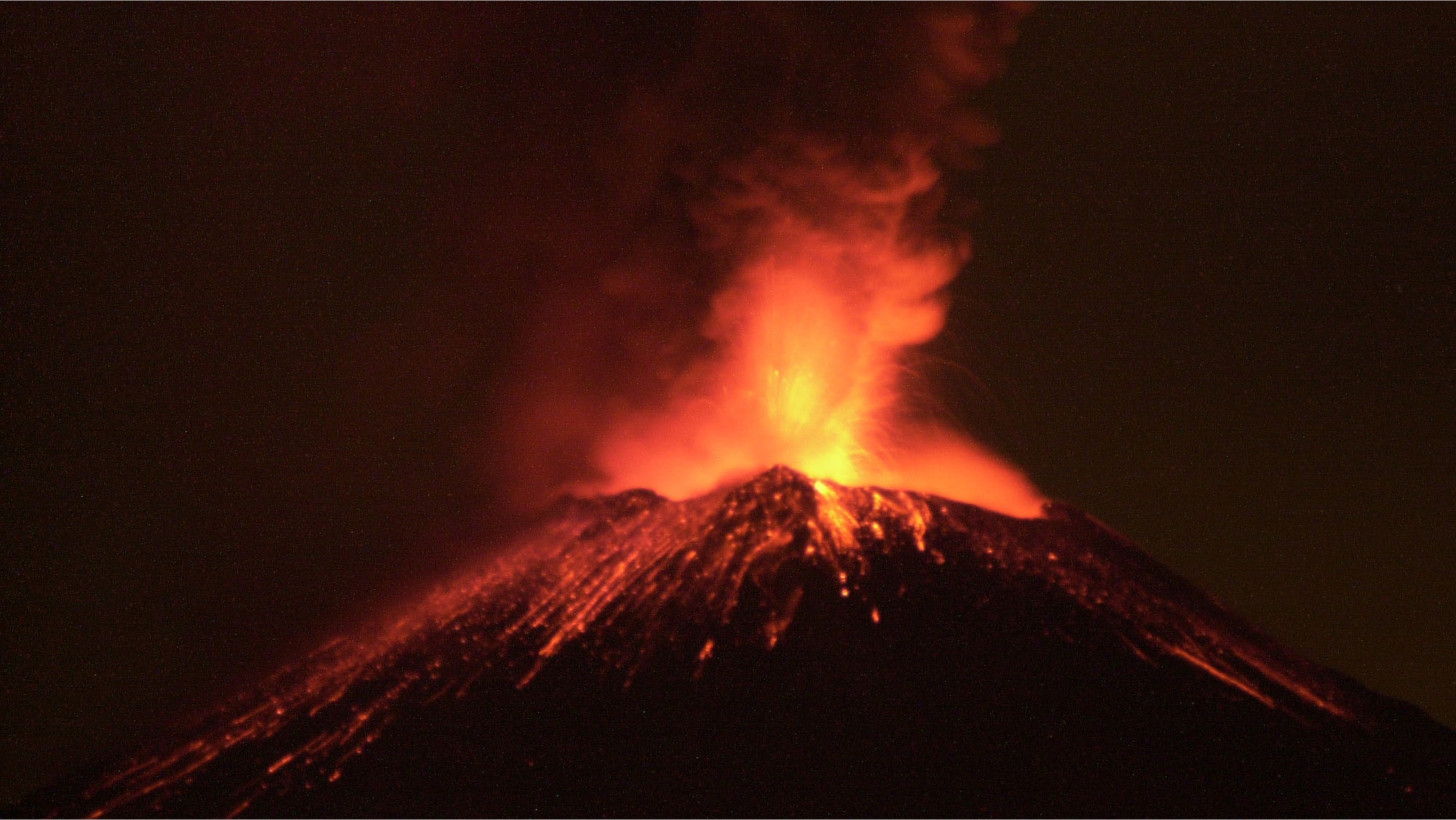 383484 01: The Popocatepetl volcano spews rocks and ash early December 19, 2000 in central Mexico. Centuries after its last catastrophic eruption, the volcano is showing signs of activity and has forced the evacuation of people from villages nearby. (Photo by Susana Gonzalez/Newsmakers)