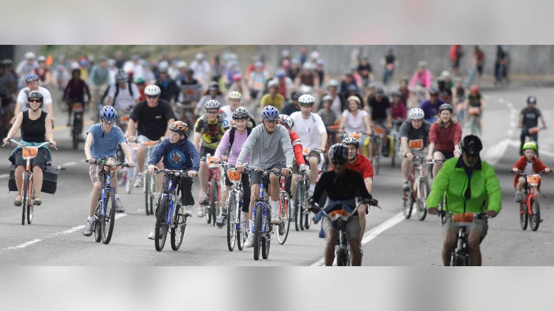 FILE - In this Aug. 8, 2010 file photo, thousands of bicyclists ride on the Providence Bridge Pedal in Portland, Ore. Portland is known as one of America's most bike-friendly cities, but cyclists have become so alarmed by a growing number of bike thefts that Portland police are creating a task force to catch more of the culprits. (AP Photo/Rick Bowmer, File)