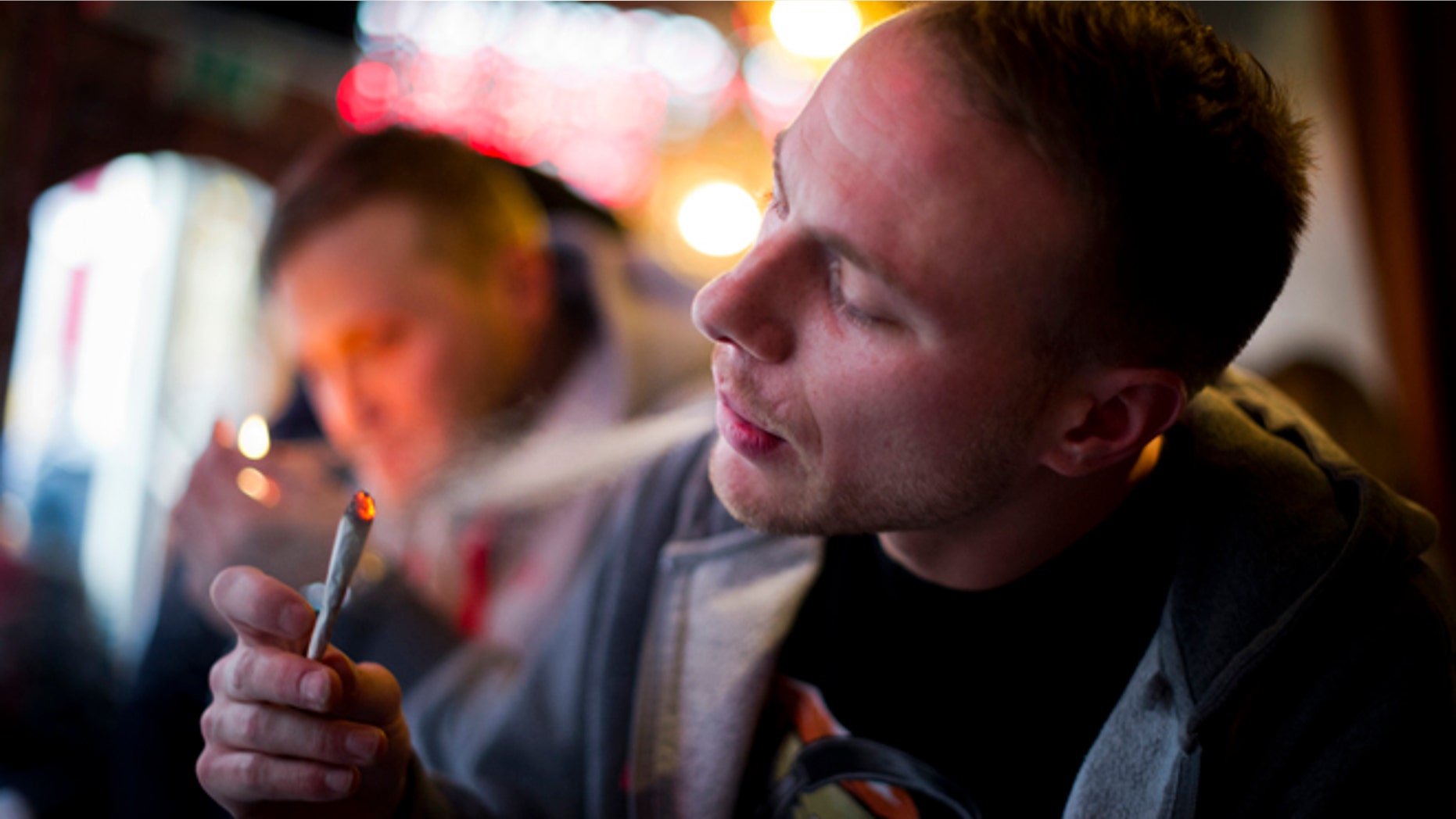 AMSTERDAM, NETHERLANDS - NOVEMBER 01: Jay, 29 years old from London, smokes cannabis in a coffee shop on November 1, 2012 in the center of Amsterdam, Netherlands. Coffee shops in the Dutch captial will remain open to tourists after its mayor, Eberhard van der Laan, decided that tourists will not be banned from the 220 coffee shops in Amsterdam where marijuana and hashish are openly sold and consumed. The decision came after the new government of the Netherlands stated that it would be up to local authorities to decide whether or not to impose a ban on cannabis. (Photo by Jasper Juinen/Getty Images)