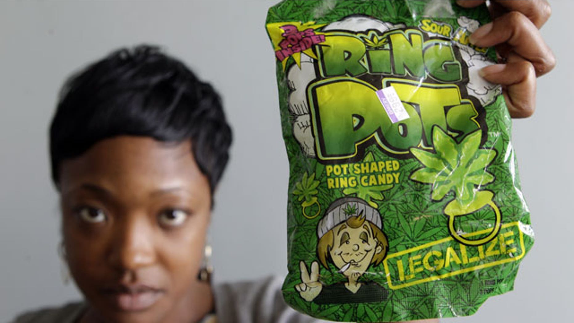 Oct. 6: Felicia Williams, Community Liason for Buffalo City Council member Darius Pridgen, holds a package of "Ring Pots" candy in Buffalo, N.Y.