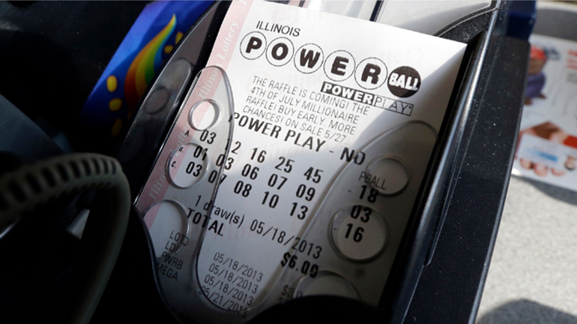 May 18, 2013: A Powerball lottery ticket is printed out of a lottery machine at a convenience store in Chicago on in this file photo.