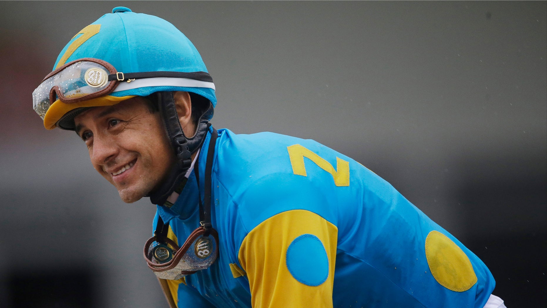 Jockey Victor Espinoza celebrates aboard American Pharoah after winning the 140th Preakness Stakes horse race at Pimlico Race Course, Saturday, May 16, 2015, in Baltimore. (AP Photo/Patrick Semansky)