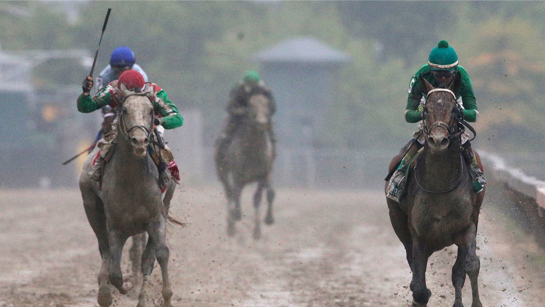 Exaggerator, right, with Kent Desormeaux aboard wins the 141st Preakness Stakes horse race at Pimlico Race Course, Saturday, May 21, 2016, in Baltimore. Cherry Wine, left, with Corey Lanerie aboard places second. (AP Photo/Patrick Semansky)