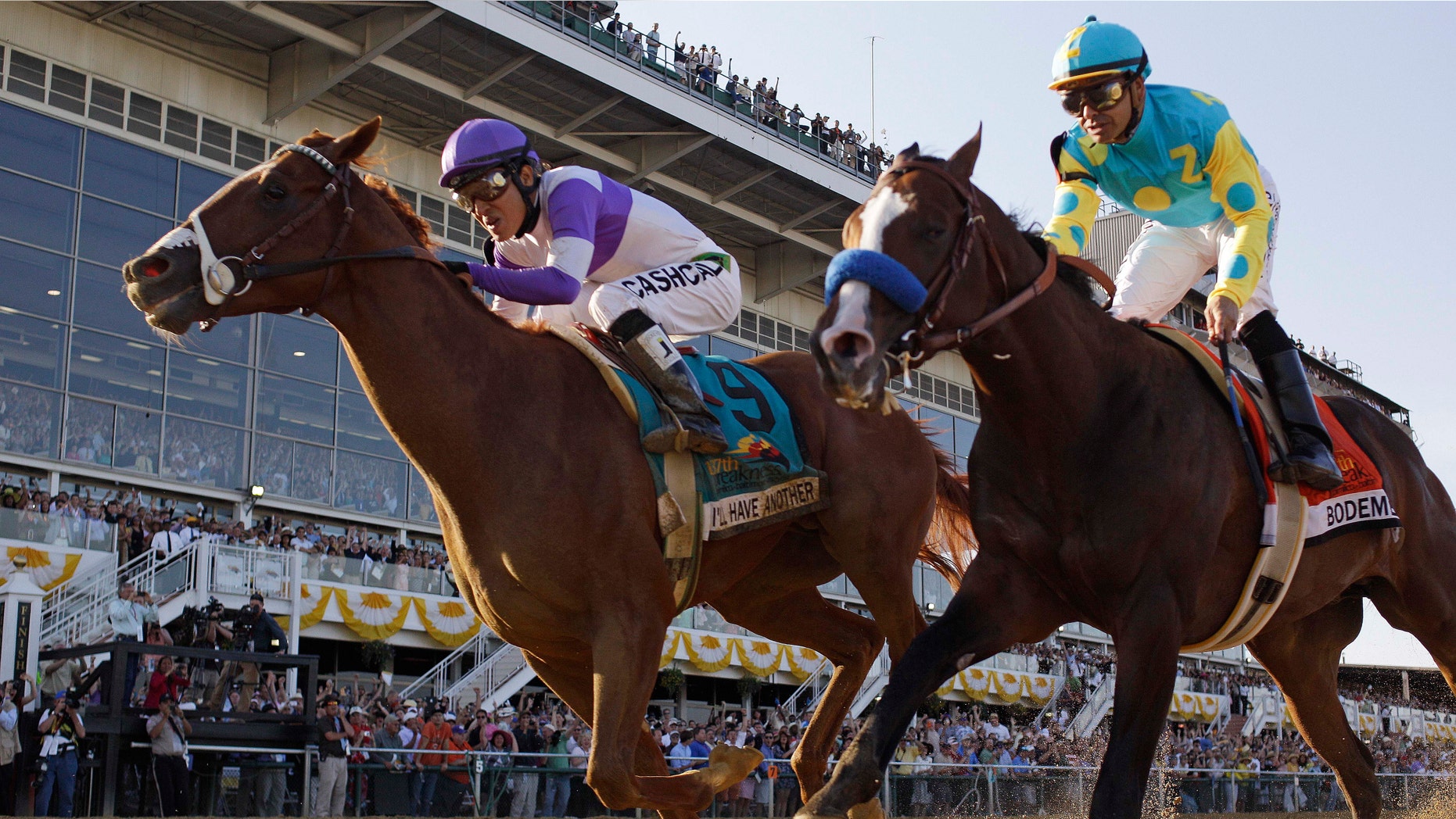 I'll Have Another (9), ridden by Mario Gutierrez, beats Bodemeister, ridden by Mike Smith, to the finish line to win the 137th Preakness Stakes horse race at Pimlico Race Course, Saturday, May 19, 2012, in Baltimore.(AP Photo/Matt Slocum)