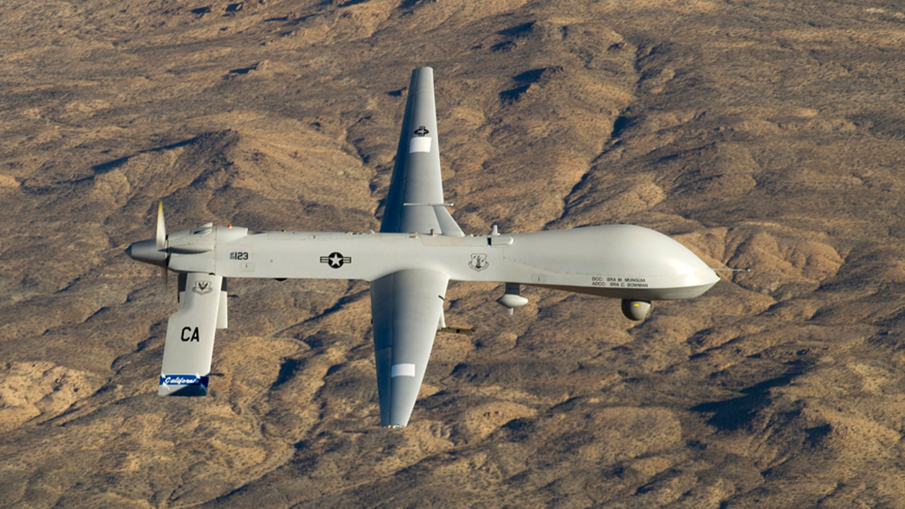 A U.S. Air Force MQ-1 Predator unmanned aerial vehicle assigned to the California Air National Guard's 163rd Reconnaissance Wing flies near the Southern California Logistics Airport in Victorville, Calif., January 7, 2012