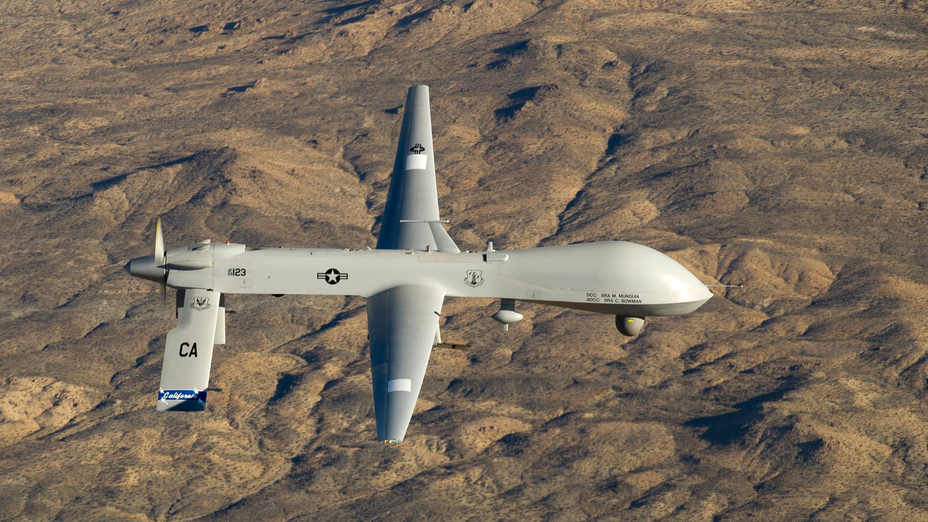 A U.S. Air Force MQ-1 Predator unmanned aerial vehicle assigned to the California Air National Guard's 163rd Reconnaissance Wing flies near the Southern California Logistics Airport in Victorville, California in this January 7, 2012 USAF handout photo obtained by Reuters February 6, 2013. REUTERS/U.S. Air Force/Tech. Sgt. Effrain Lopez/Handout (UNITED STATES - Tags: MILITARY POLITICS) THIS IMAGE HAS BEEN SUPPLIED BY A THIRD PARTY. IT IS DISTRIBUTED, EXACTLY AS RECEIVED BY REUTERS, AS A SERVICE TO CLIENTS. FOR EDITORIAL USE ONLY. NOT FOR SALE FOR MARKETING OR ADVERTISING CAMPAIGNS - RTR3DF74