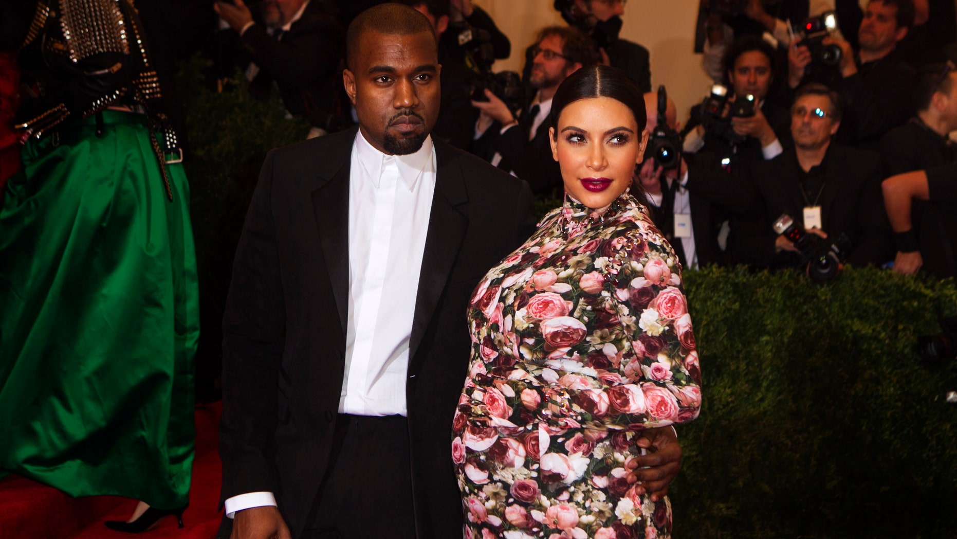 Singer Kanye West and reality television actress Kim Kardashian arrive at the Metropolitan Museum of Art Costume Institute Benefit celebrating the opening of "PUNK: Chaos to Couture" in New York, May 6, 2013.