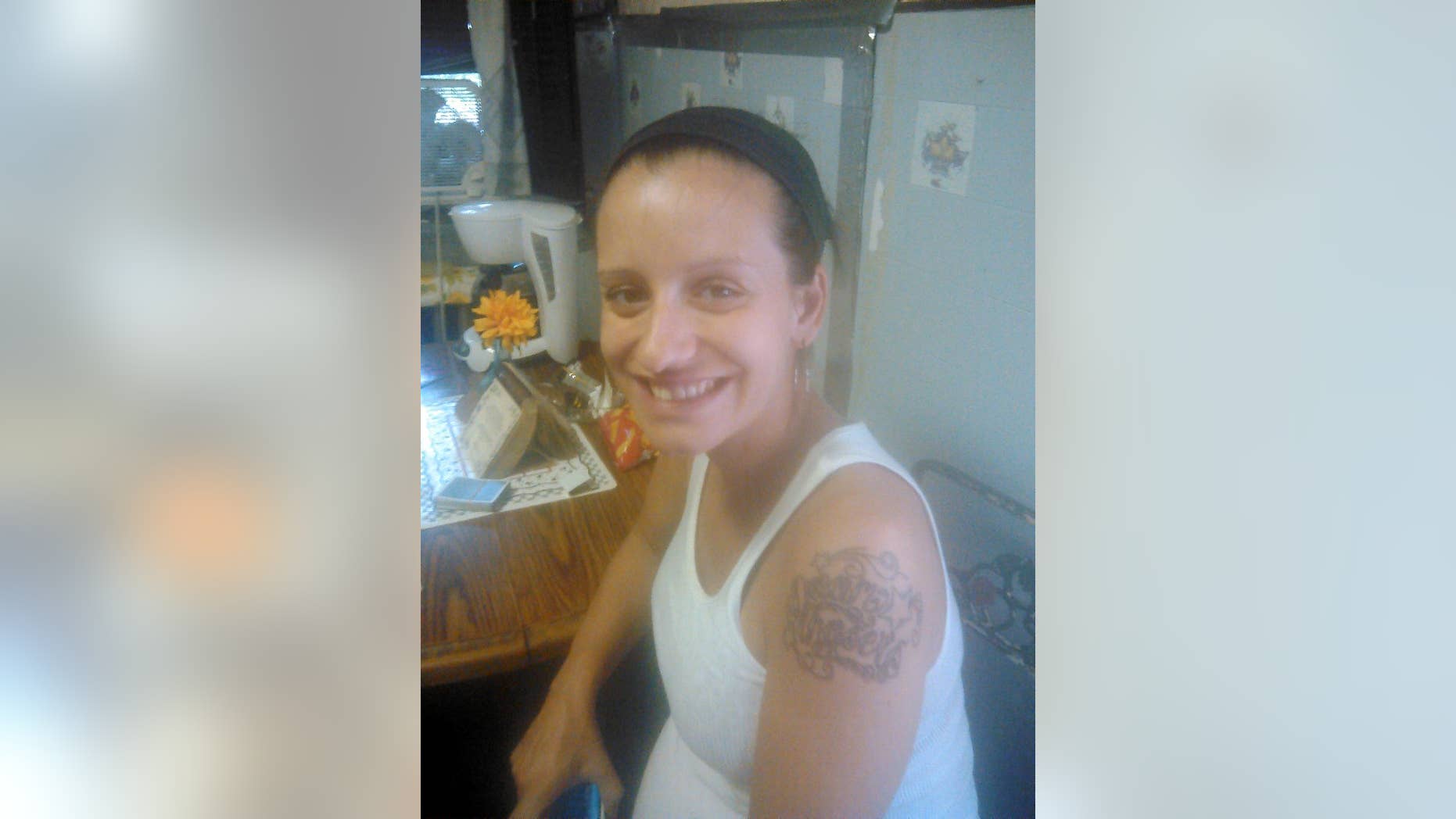 In this undated photo provided by Judith Luckangelo, 25-year-old Megan Doto is show in Philadelphia. Police say on Sunday, Aug. 24, 2014, a bullet struck and killed the 25-year-old Doto, who was eight months pregnant. Doto died less than two hours later. Her child died early Monday at Temple University Hospital. A $40,000 reward is being offered in the deaths of a Luckangelo and her child. Philadelphia Homicide Capt. James Clark says a man dressed in black fired more than 10 shots at a car a block away Sunday morning. (AP Photo/Judith Luckangelo)