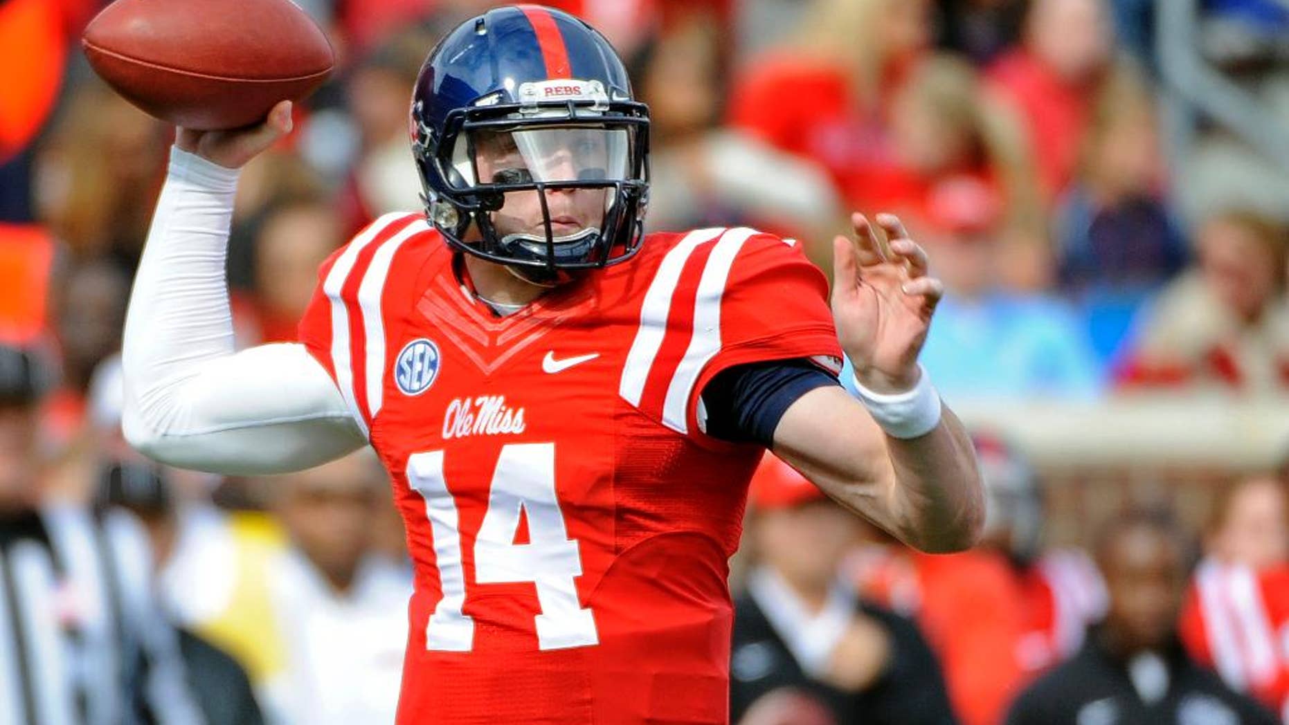 Mississippi quarterback Bo Wallace (14) releases a pass during the first half of an NCAA college football game against Presbyterian in Oxford, Miss., Saturday, Nov. 8, 2014. (AP Photo/Thomas Graning)