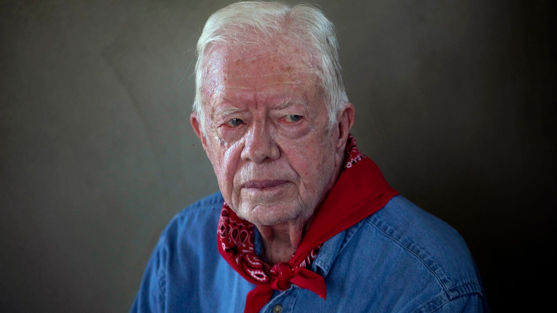 Former U.S. President Jimmy Carter pauses during an interview as he and his wife Rosalynn visit a Habitat for Humanity project in Leogane, Haiti.