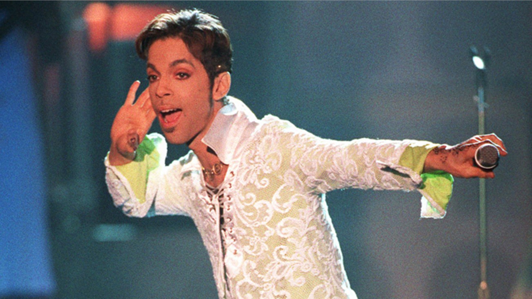 FILE - In this April 10, 1997 file photo, Prince performs a medley of "Take Me With U" and "Rasberry Beret" at the 4th annual VH1 Honors in Universal City, Calif. Prince's publicist has confirmed that Prince died at his home in Minnesota, Thursday, April 21, 2016. He was 57. (AP Photo/Mark J. Terrill, File)