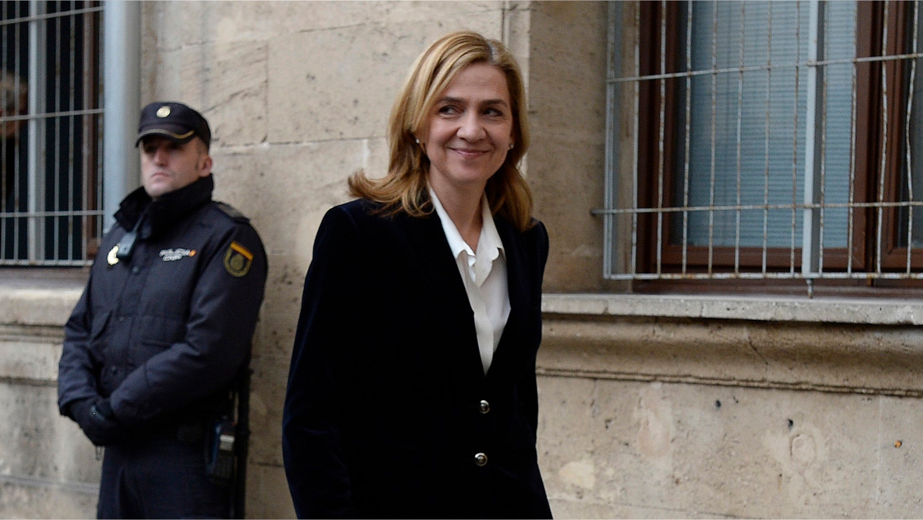 FILE - In this Feb. 8, 2014 file photo, Spain's Princess Cristina arrives at the courthouse of Palma de Mallorca in Palma Mallorca, Spain. A Spanish judge on Monday Dec. 22, 2014 has ordered Princess Cristina to be tried along with her husband on charges of tax fraud, marking the first time that a member of the countryâs royal family heads to court since the royalty was restored in 1975. The legal troubles of King Felipe VIâs sister during a four-year probe have damaged the Spanish monarchy's image. (AP Photo/Manu Fernandez, File)