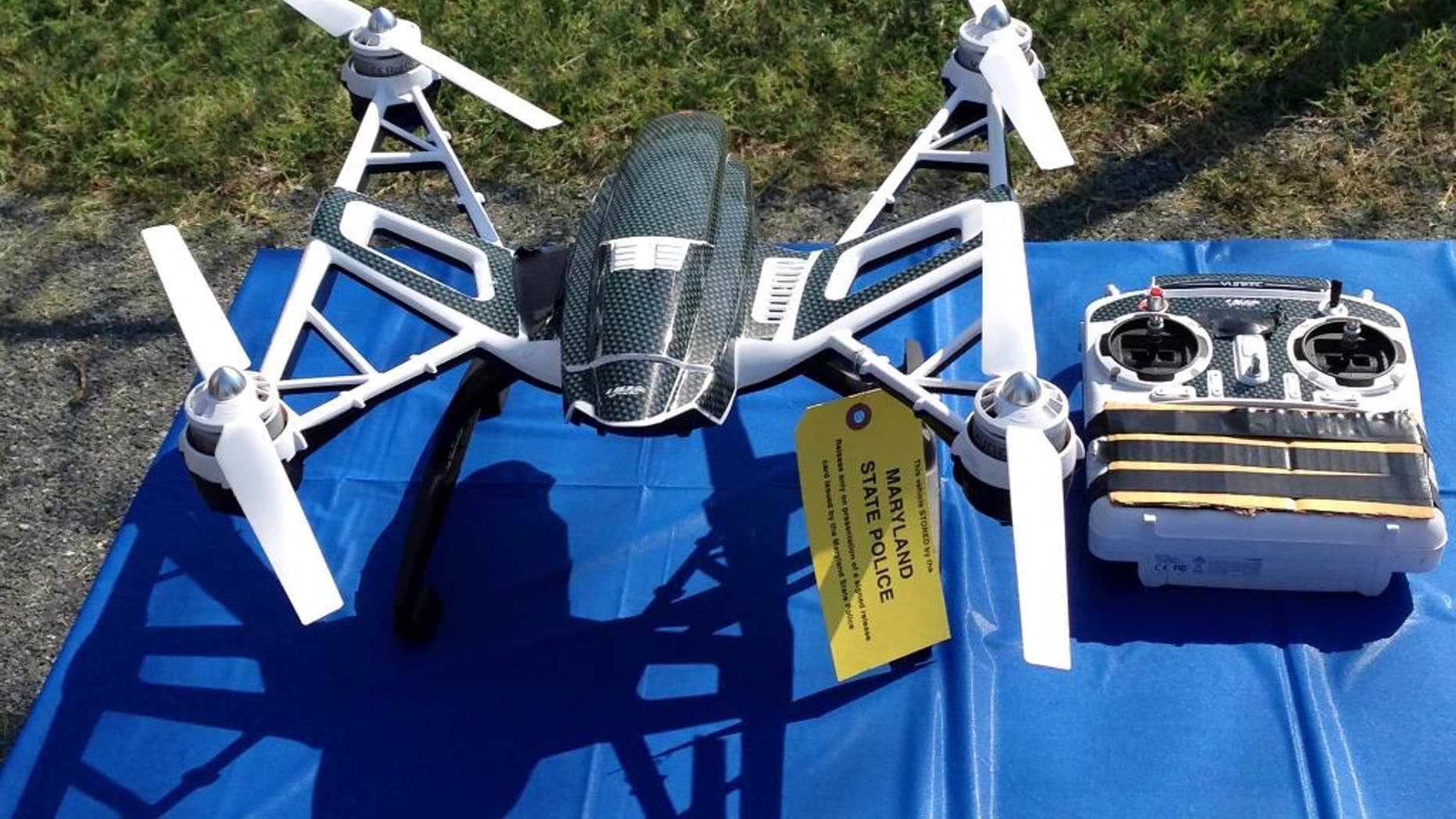 This photo shows a Yuneec Typhoon drone and controller Monday, Aug. 24, 2015, in Jessup, Md. Maryland State Police and prison officials say two men planned to use the drone to smuggle drugs, tobacco and pornography videos into the maximum-security Western Correctional Institution near Cumberland, Md. Police arrested the men with the drone, the materials and a handgun in a vehicle Saturday, Aug. 22, 2015. (AP Photo/David Dishneau)