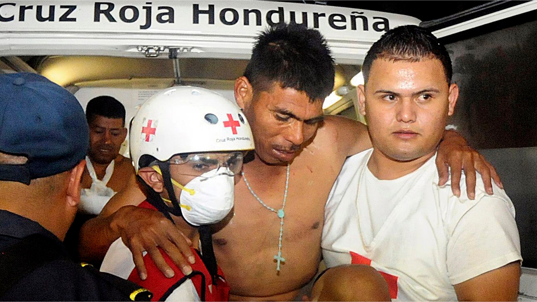 An injured inmate is carried as he arrives at the hospital after a fire broke out at the prison in Comayagua, Honduras, a town 90 miles (140 kilometers) north of the Central American country's capital, Tegucigalpa, early Wednesday, Feb. 15, 2012. Radio reports from Comayagua said dozens of prisoners were burned beyond recognition and the prison was destroyed by the flames. The fire claimed the lives of at least 272 inmates. (AP Photo/Fernando Antonio)