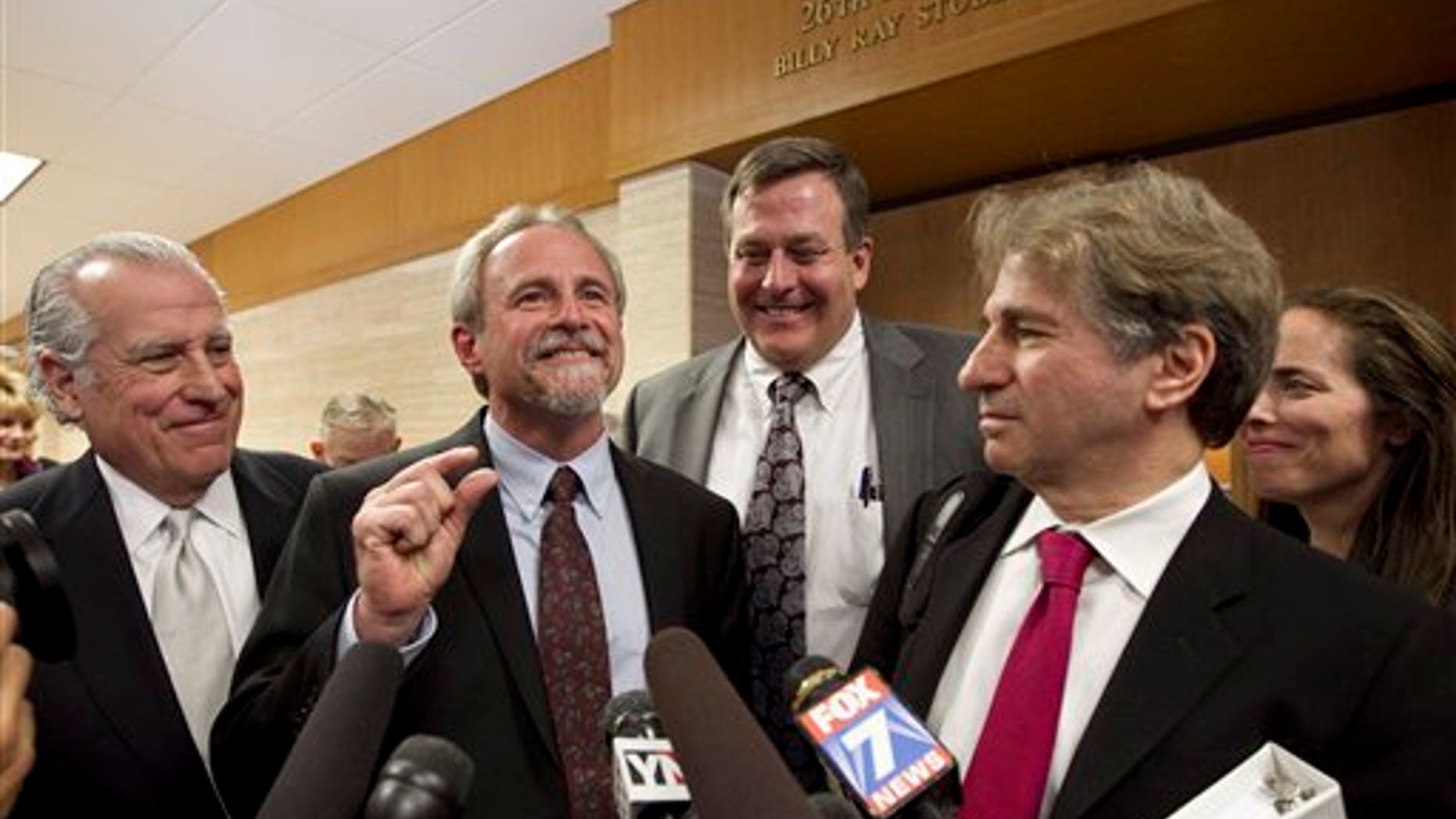 Feb. 10: Michael Morton, second from left, and his legal team, left to right, Gerald Goldstein, John Raley, Barry Scheck and Nina Morrison speak to the media after Judge Sid Harle ruled in favor of a court of inquiry fpr Judge Ken Anderson at the Williamson County Justice Center in Georgetown, Texas.