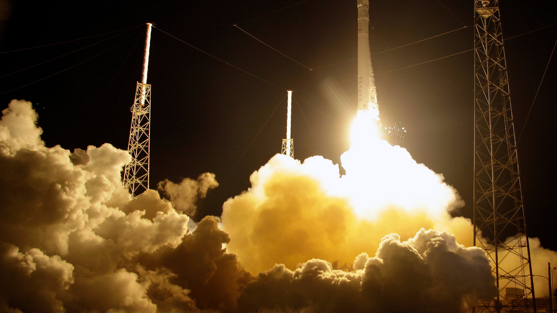 The Falcon 9 SpaceX rocket lifts off from space launch complex 40 at the Cape Canaveral Air Force Station in Cape Canaveral, Fla. on Sunday, Oct. 7, 2012. The rocket is carrying supplies to the International Space Station. (AP Photo/Terry Renna)
