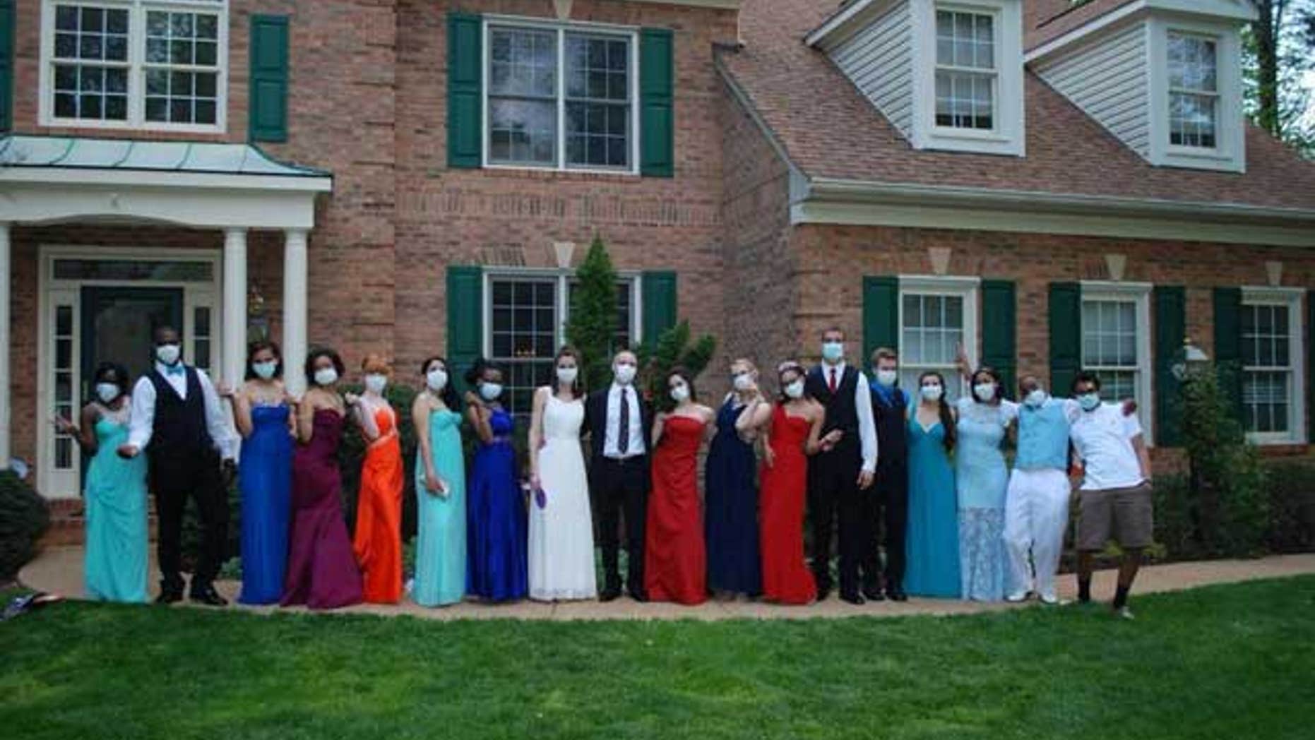 Jared Hill and his friends on prom night, wearing protective masks. (Image courtesy of My Fox Atlanta.)