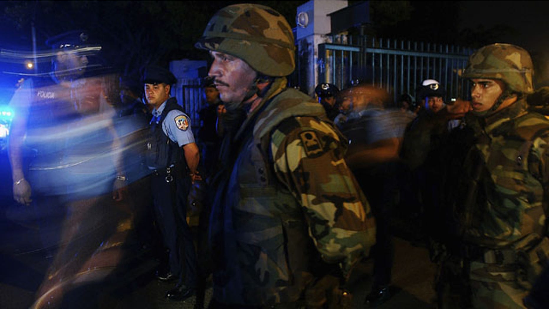 SAN JUAN, PUERTO RICO - JULY 23: U.S. Army Specialist Maximo Sanchez joins Puerto Rico Police Department officers on an early morning patrol July 23, 2004 in San Juan, Puerto Rico. Puerto Rico Governor Sila Maria Calderon activated 500 National Guardsmen to try to bring stability after a crime wave swept the island. (Photo by Jose Jimenez/Getty Images) *** Local Caption *** US Army Specialist Maximo Sanchez participates in early morning patro