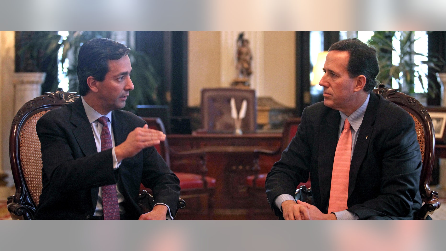 Commonwealth of Puerto Rico Governor Luis Fortuno, left, talks to Republican presidential candidate, former Pennsylvania Sen. Rick Santorum during their meeting at the governor's mansion La Fortaleza, or Fortess, in San Juan, Puerto Rico, Wednesday March 14, 2012. (AP Photo/Dennis M. Rivera Pichardo)