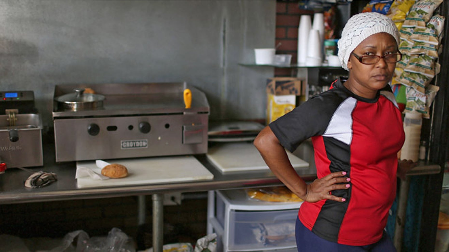SAN JUAN, PUERTO RICO - JUNE 30: Rosaura Guzman waits for customers at John Cafe a day after Puerto Rican Governor Alejandro Garcia Padilla gave a televised speech regarding the governments $72 billion debt on June 30, 2015 in San Juan, Puerto Rico. The Governor said in his speech that the people will have to sacrifice and share in the responsibilities for pulling the island out of debt. (Photo by Joe Raedle/Getty Images)