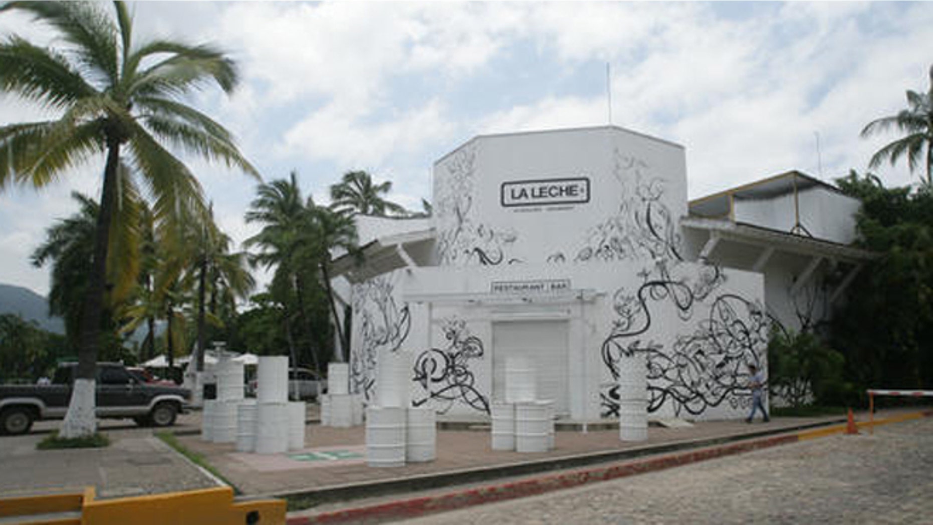 The entrance of the restaurant "La Leche" stands closed after armed men abducted as many as 16 people who were dining in the upscale restaurant in Puerto Vallarta, Mexico, Monday, Aug. 15, 2016. Jalisco state prosecutor Eduardo Almaguer said in a news conference that preliminary results of the investigation indicate that all involved, kidnappers and kidnapped, were members of criminal organizations. (AP Photo/David Diaz)