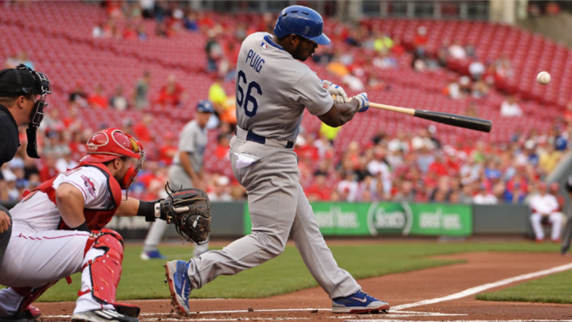 CINCINNATI, OH - AUGUST 25: Yasiel Puig #66 of the Los Angeles Dodgers hits an RBI double in the first inning against the Cincinnati Reds at Great American Ball Park on August 25, 2015 in Cincinnati, Ohio. (Photo by Jamie Sabau/Getty Images)