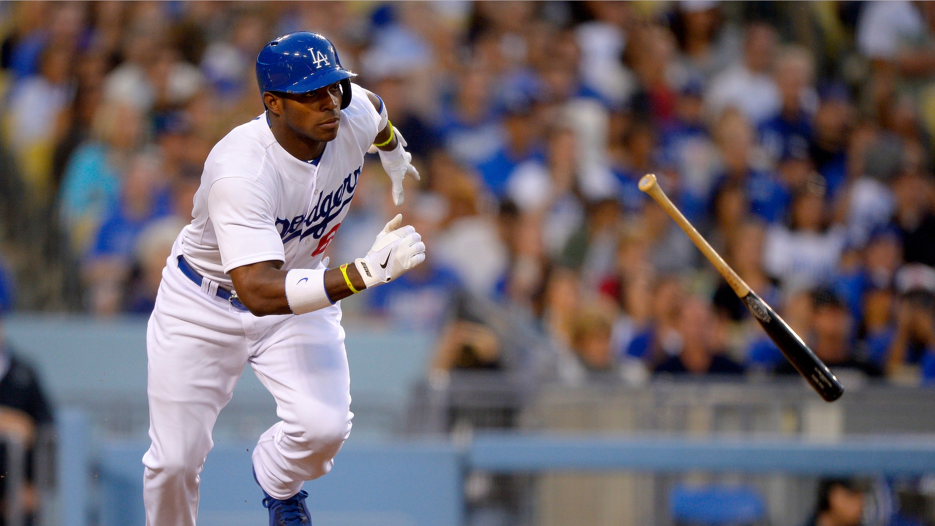 Los Angeles Dodgers' Yasiel Puig hits a single against the Atlanta Braves, Saturday, June 8, 2013, in Los Angeles. (AP Photo/Mark J. Terrill)