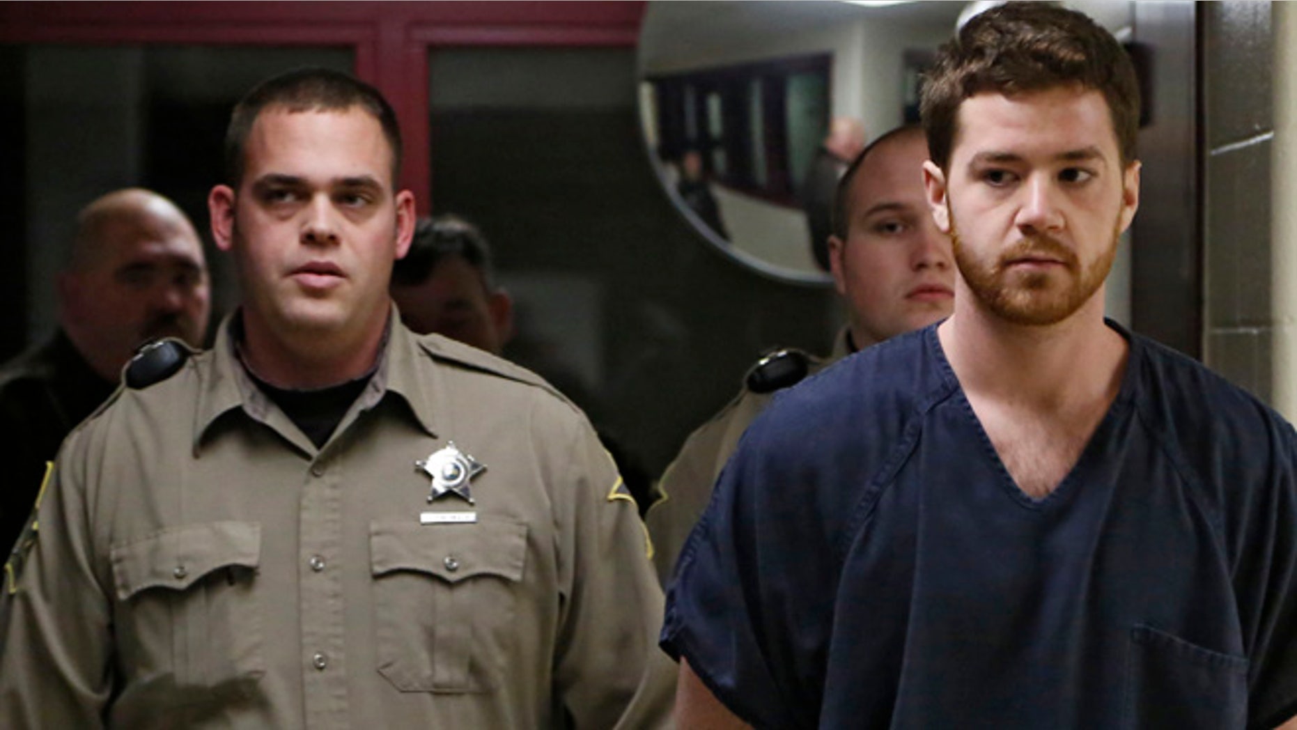 Jan. 23: Cody Cousins, right, walks inside the Tippecanoe County Jail in Lafayette, Ind., on the way to his initial hearing on charges of murder in Tuesday's shooting and stabbing death of engineering student Andrew Boldt on the campus of Purdue University.