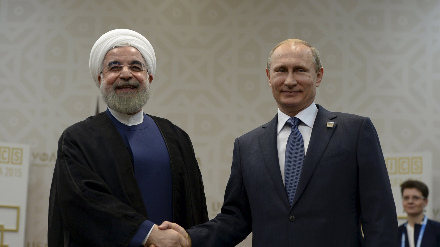 July 9, 2015 - FILE photo of Russian President Vladimir Putin shaking hands with Iran's President Hassan Rouhani during their meeting in Ufa, Russia. 2 Russian warships have docked in northern Iran for naval training exercises, Iranian media reported.