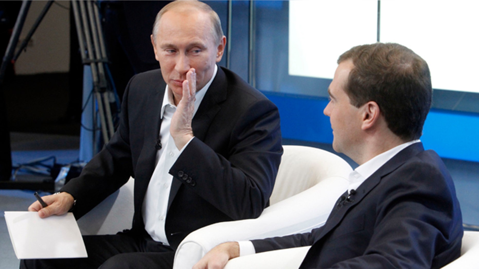 Dec. 1: Russia's President Dmitry Medvedev, right, and Prime Minister Vladimir Putin meet with supporters in Moscow.