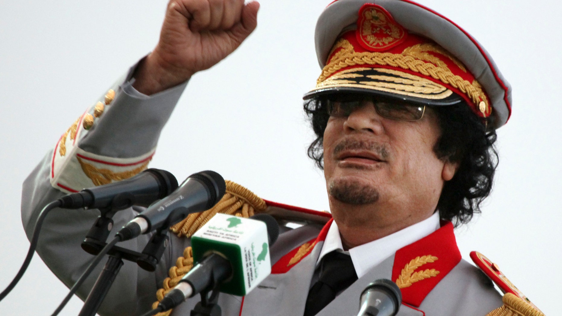 June 12, 2010: Qaddafi talks during a ceremony to mark the 40th anniversary of the evacuation of the American military bases in the country, in Tripoli, Libya.