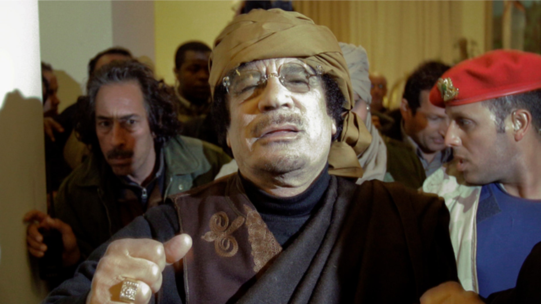 March 8: Libyan Leader Muammar Qaddafi arrives at a hotel to give television interviews in Tripoli, Libya.