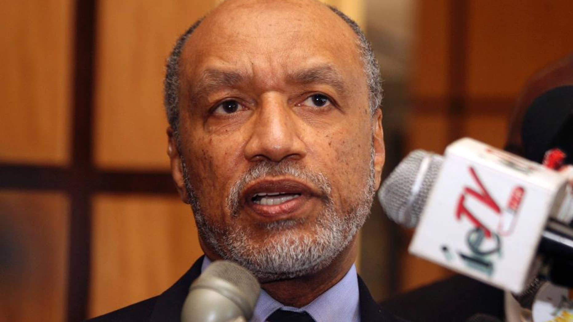 FILE - In this May 10, 2011 file picture of Mohamed bin Hammam, chief of the Asian Football Confederation, as he talks to local media in Port of Spain, Trinidad & Tobago. Organizers of the 2022 World Cup in Qatar on Sunday June 1, 2014 denied fresh allegations of wrongdoing after a British newspaper report questioned the integrity of choosing the emirate as tournament host. The Sunday Times said a "senior FIFA insider" had provided "hundreds of millions of emails, accounts and other documents" detailing payments totaling $5 million that Qatari official Mohamed bin Hammam allegedly gave football officials to build support for the bid. (AP Photo/Shirley Bahadur, File)