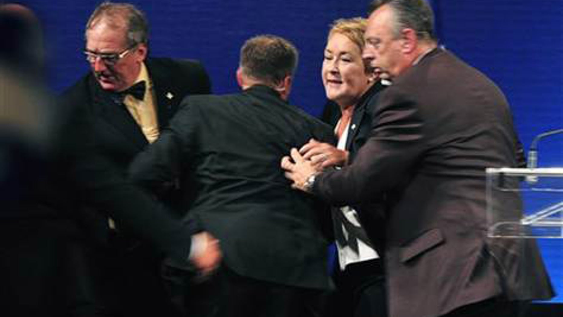 Sept. 4, 2012: Parti Quebecois Leader Pauline Marois is whisked off stage as she delivered her victory speech in Quebec.