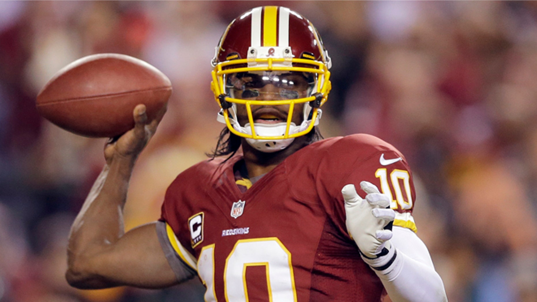 Jan. 6, 2013: In this file photo, Washington Redskins quarterback Robert Griffin III passes the ball during the second half of an NFL wild card playoff football game against the Seattle Seahawks in Landover, Md.