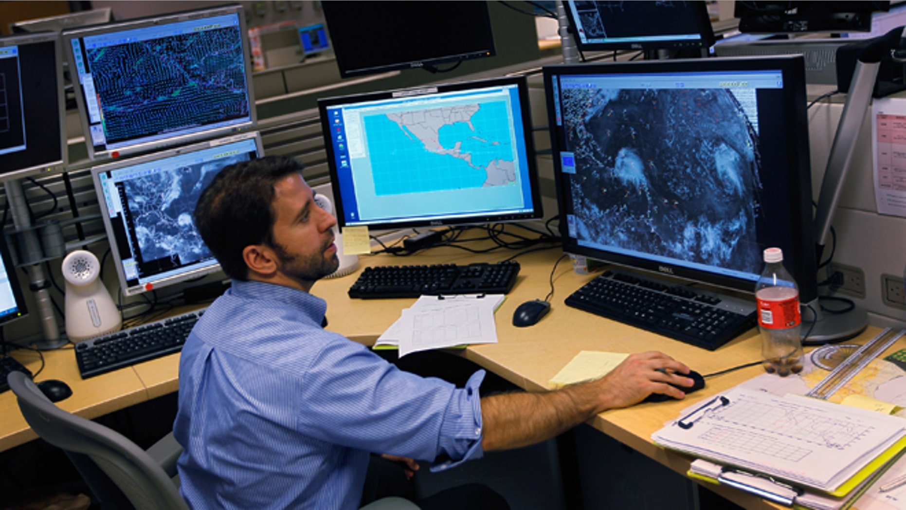 MIAMI, FL - AUGUST 22: Todd Kimberlain a hurricane forcaster studies computer models as he tracks Hurricane Irene at the National Hurricane Center on August 22, 2011 in Miami, Florida. Irene is the first Hurricane of the 2011 Atlantic season with winds at 80mph currently and may hit the East coast later this week with higher winds projected. (Photo by Joe Raedle/Getty Images)