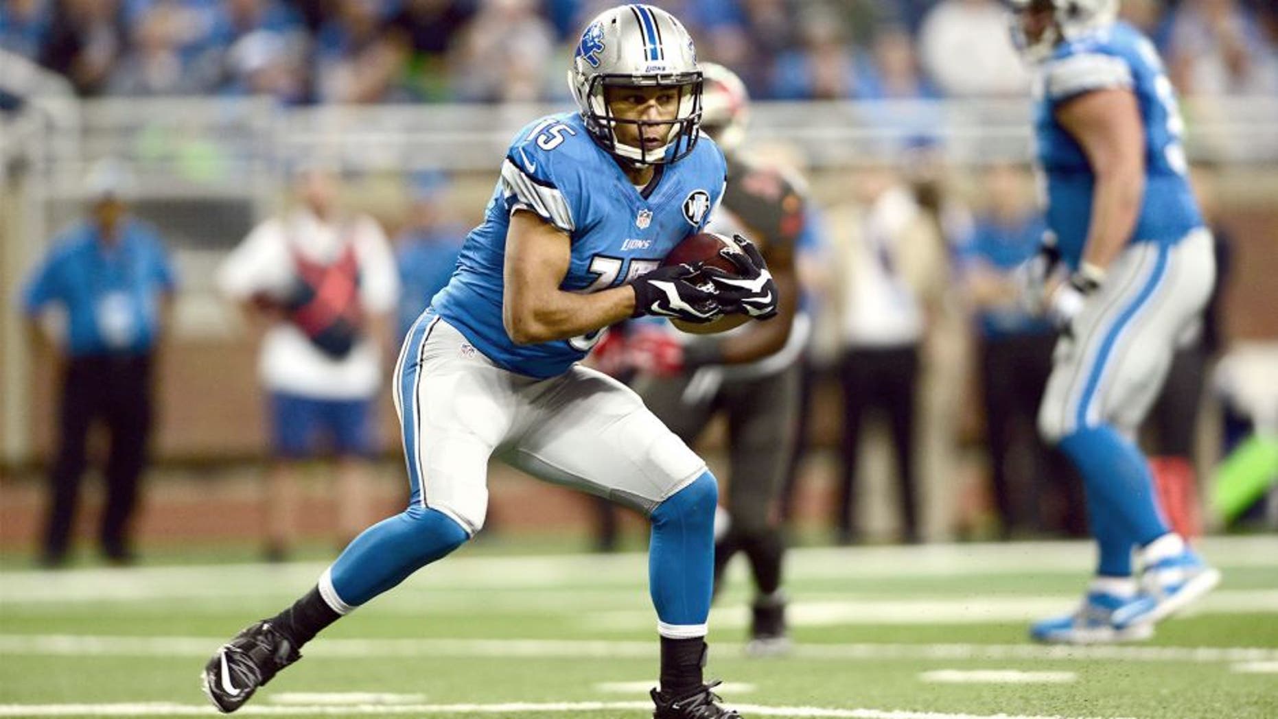 Dec 7, 2014; Detroit, MI, USA; Detroit Lions wide receiver Golden Tate (15) makes a catch and looks to get vertical during the first quarter against the Tampa Bay Buccaneers at Ford Field. Mandatory Credit: Andrew Weber-USA TODAY Sports