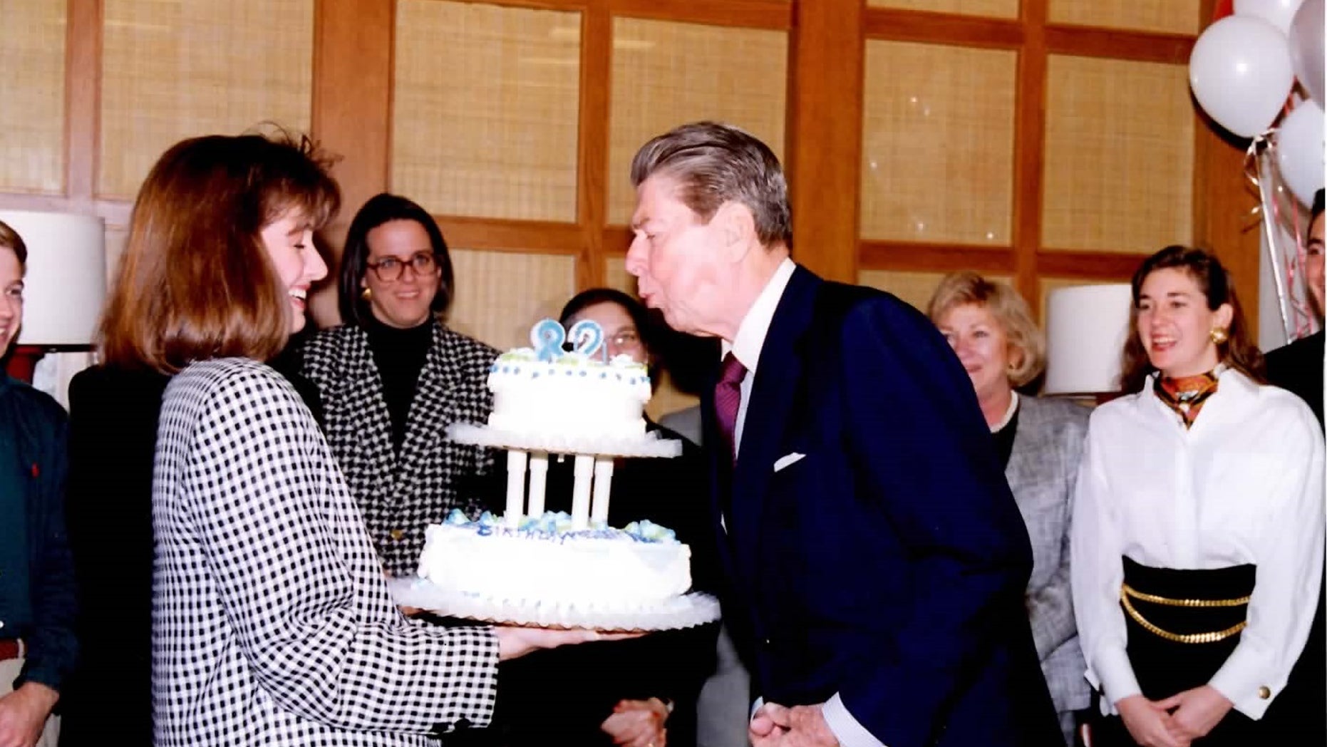 Ronald Reagan blows out the candles on his 82nd birthday, February 6, 1993, in his post-presidential office in Century City, California.