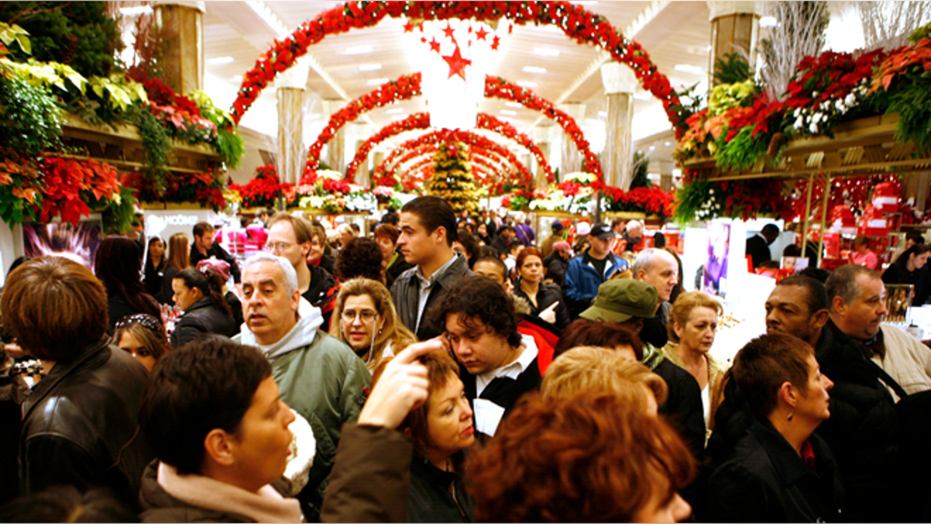 Shoppers fight the holiday crowds at Macy's at Herald Square in New York.