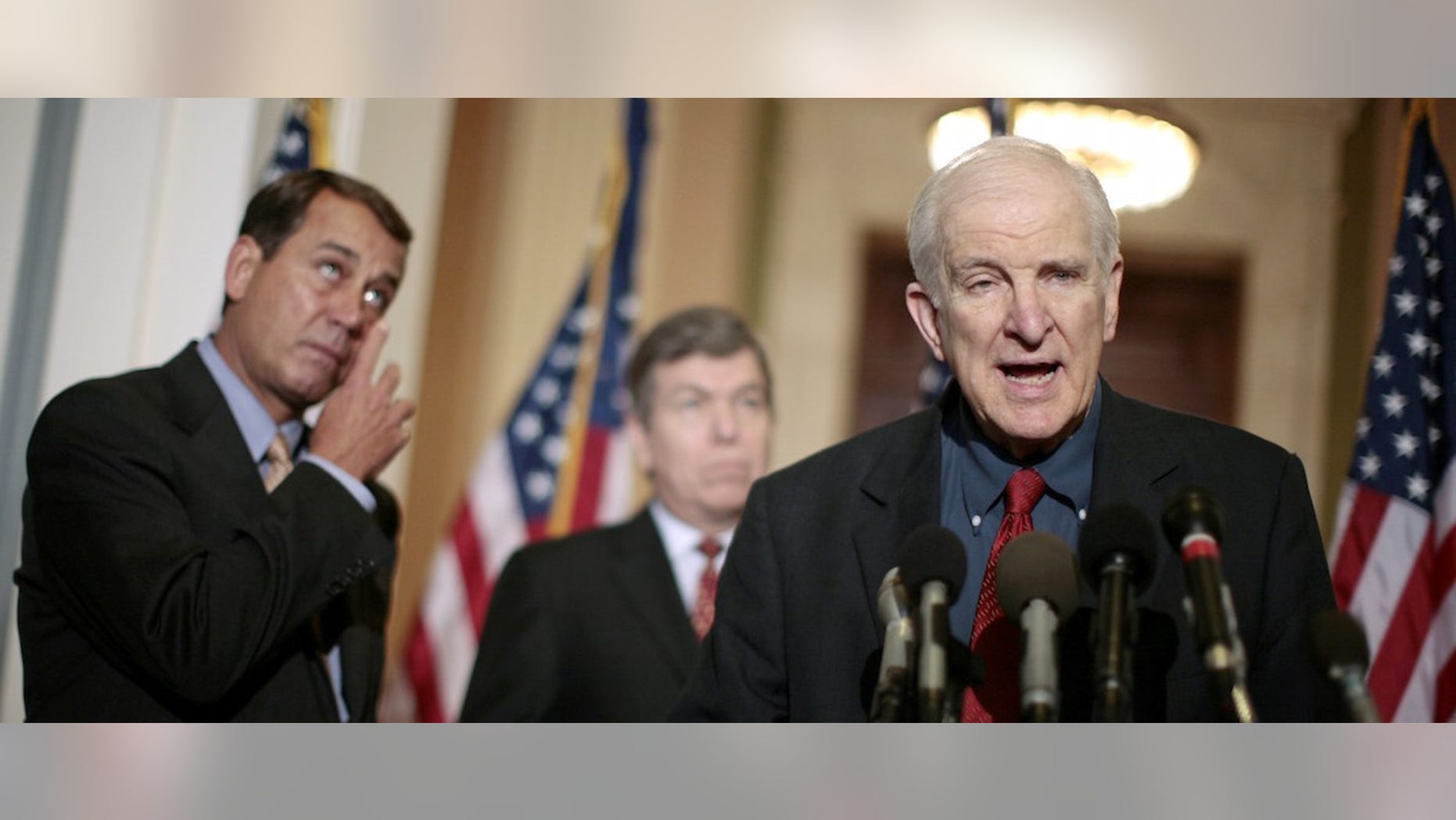 U.S. House Minority leader John Boehner (L)(R-OH) wipes tears from his face as he listens to fellow Rep. Sam Johnson (R-TX) speak about his time as a prisoner during the Vietnam war, following a Republican conference meeting on Capitol Hill in Washington February 13, 2007. Before the House began a debate on an Iraq war resolution Tuesday, Johnson said 34 years ago when he was a prisoner of war, opposition to the conflict from within America hurt the morale of troops on the ground in Vietnam, just as the current resolution may hurt the morale of troops currently in Iraq. Rep. Roy Blunt (R-MO) is pictured between Boehner and Johnson. REUTERS/Jason Reed (UNITED STATES) - RTR1MCU8
