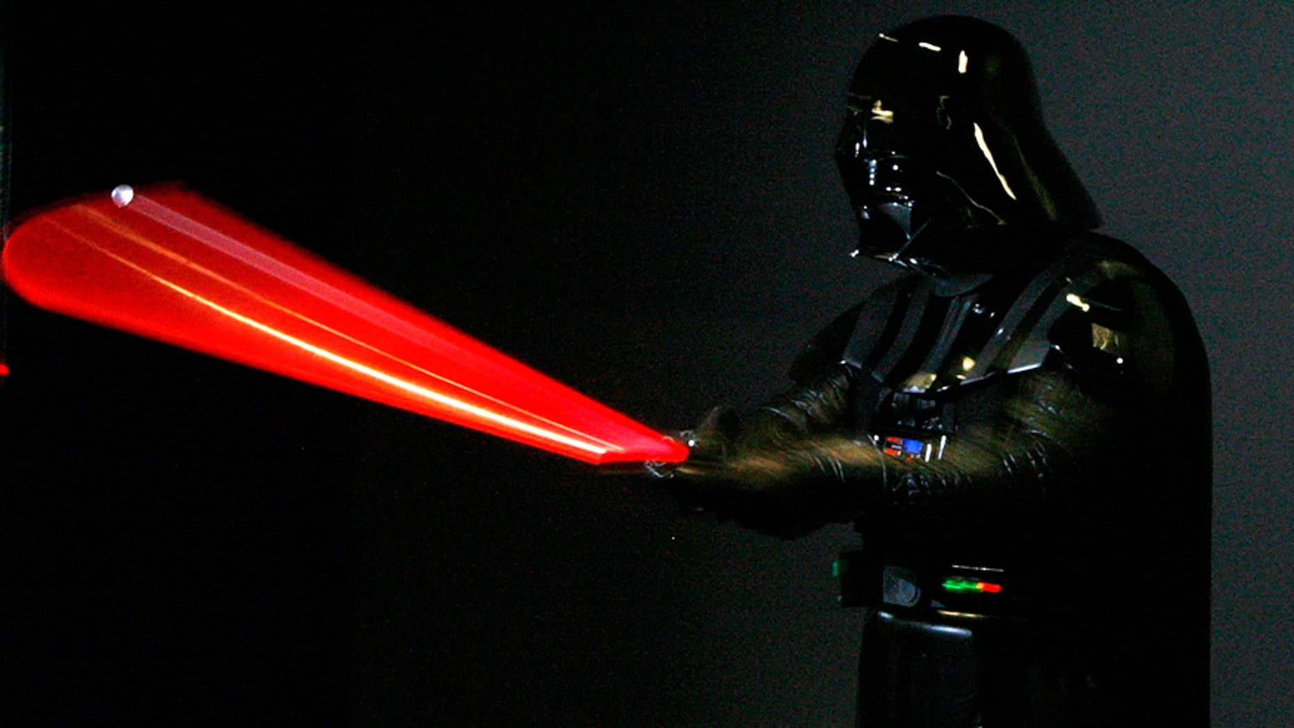 A man dressed as Star Wars character Darth Vader poses for photographers at the "Star Wars: Where Science Meets Imagination" exhibition at the Powerhouse Museum in Sydney December 3, 2008.