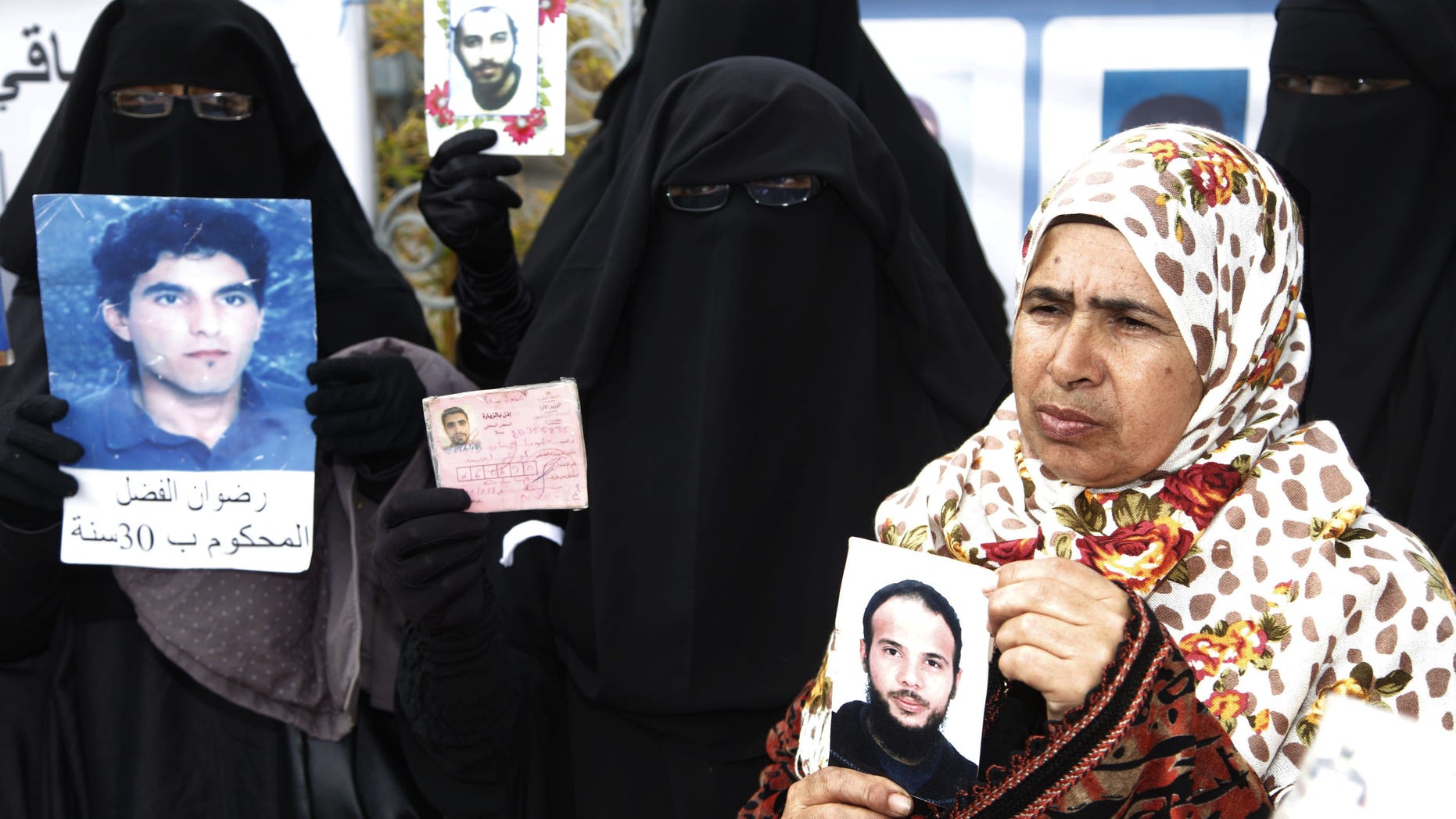 March 15, 2012: Women hold up pictures of their relatives, religious and political prisoners who are on hunger strike in Moroccan jails, as they take part in a protest to demand their release in Rabat.